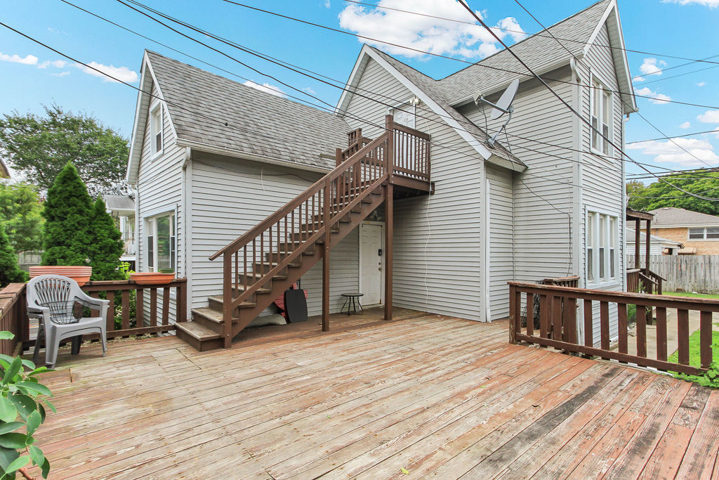 6046 West Giddings Street Chicago, IL 60630 - Photo 29 of 46 a view of a house with wooden deck