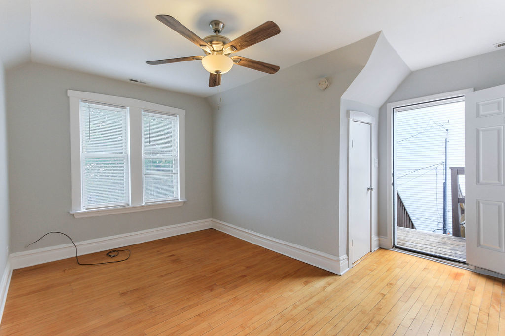 6046 West Giddings Street Chicago, IL 60630 - Photo 31 of 46 wooden floor in an empty room with a window