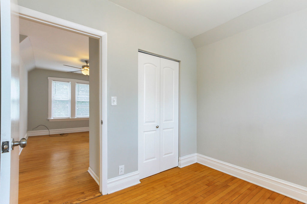 6046 West Giddings Street Chicago, IL 60630 - Photo 36 of 46 an empty room with wooden floor and windows
