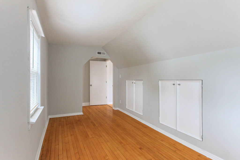6046 West Giddings Street Chicago, IL 60630 - Photo 37 of 46 a view of a room with wooden floor and a window