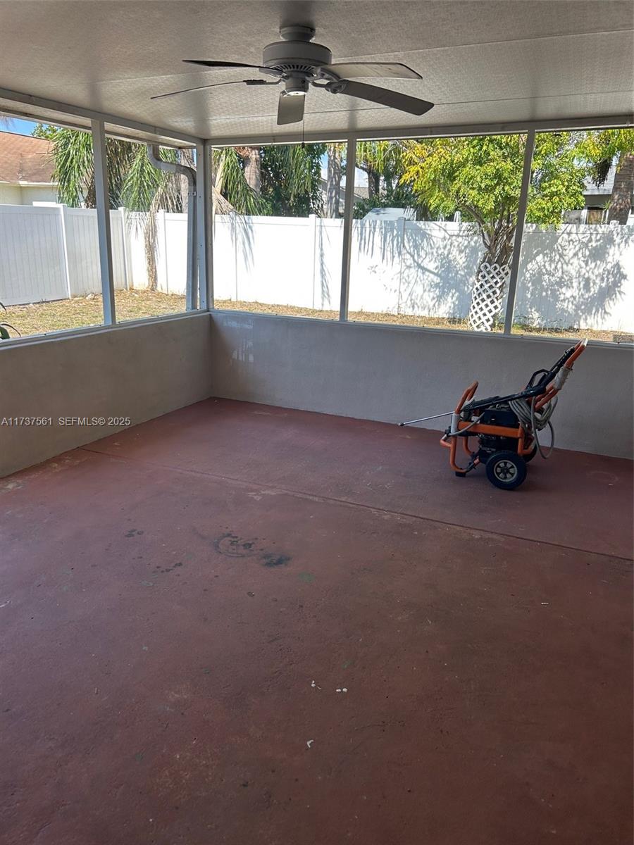 7403 Foxbloom Drive Port Richey, FL 34668 - Photo 23 of 45 an empty room with large windows