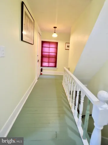 a view of a hallway with staircase
