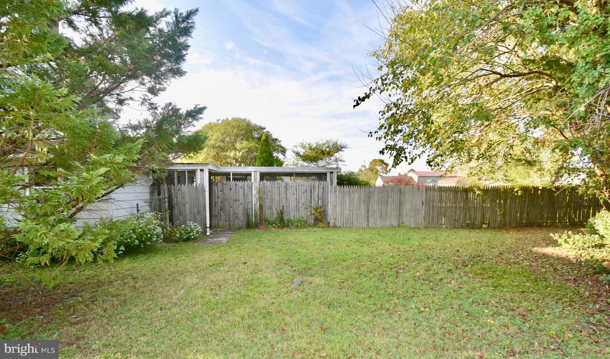 407 Main Street Sharptown, MD 21861 - Photo 29 of 32 a view of a yard with wooden fence