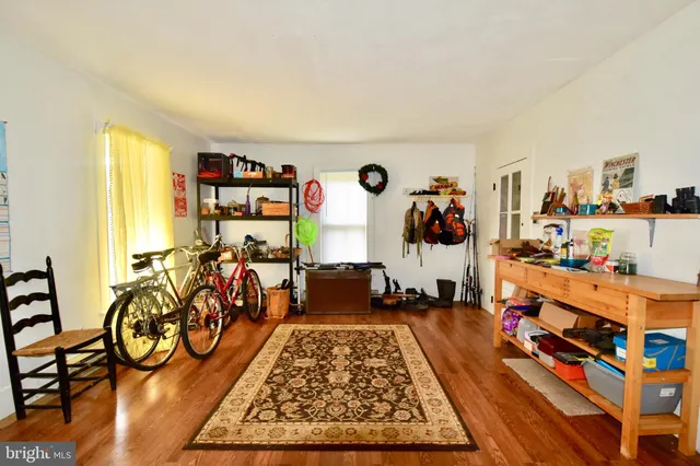 a very nice looking room with many windows and furniture