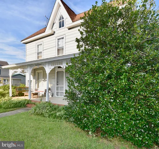front view of a house with a big yard