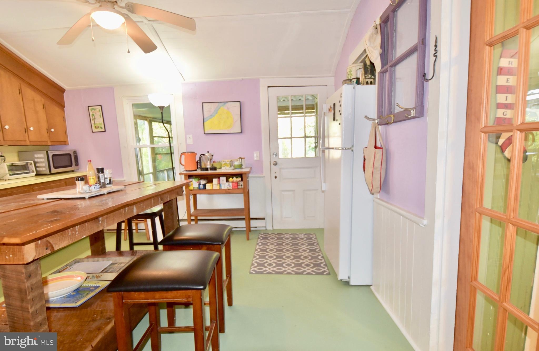 407 Main Street Sharptown, MD 21861 - Photo 6 of 32 a living room with furniture and a table