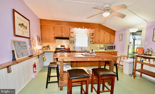 a dining table with chairs and window