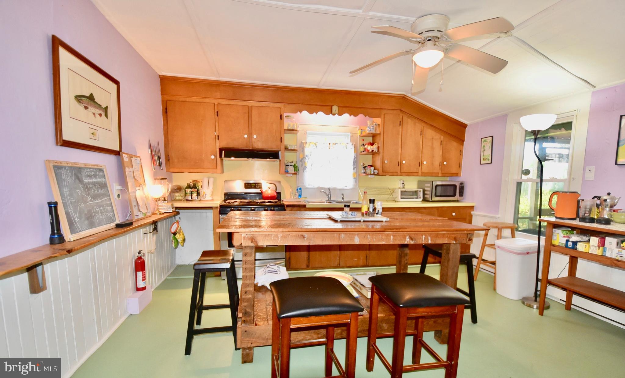 407 Main Street Sharptown, MD 21861 - Photo 7 of 32 a dining table with chairs and window
