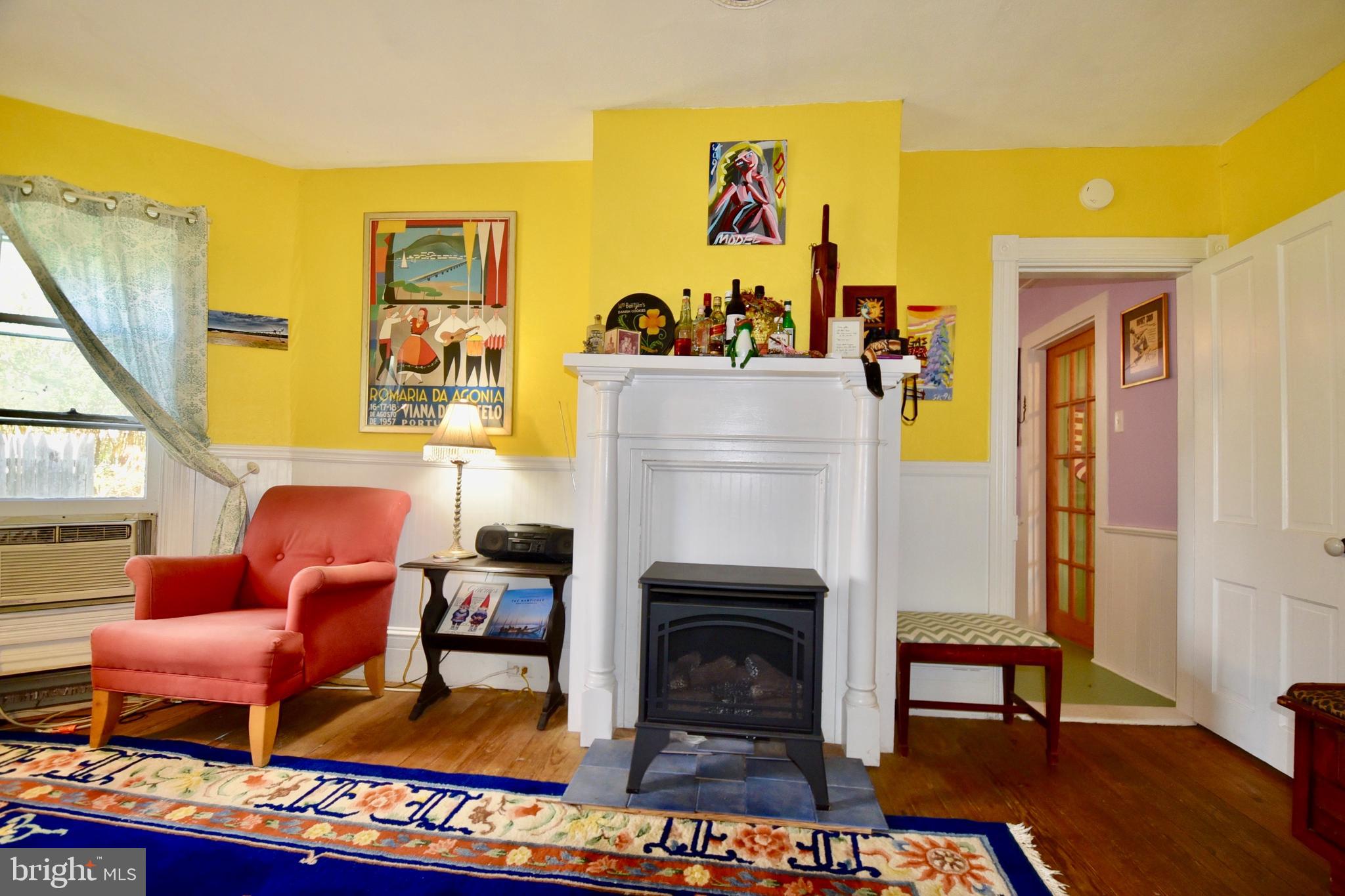 407 Main Street Sharptown, MD 21861 - Photo 9 of 32 a living room with furniture and a fireplace