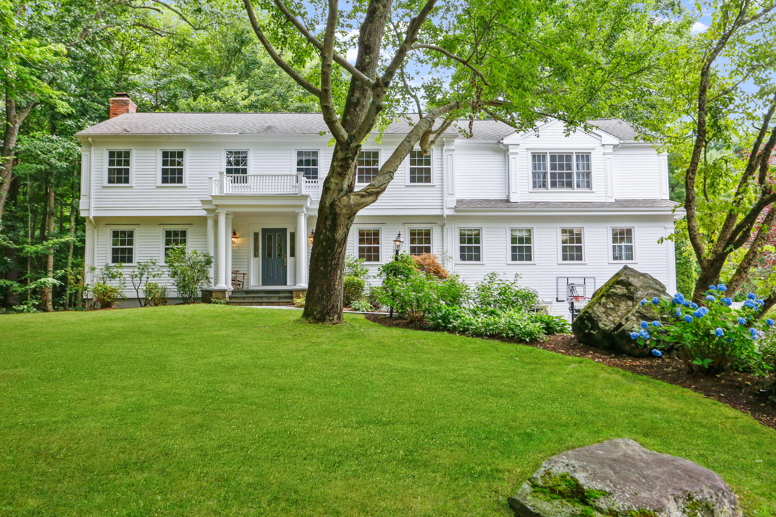 53 Country Club Road Darien, CT 06820 - Photo 2 of 35 a front view of a house with a garden