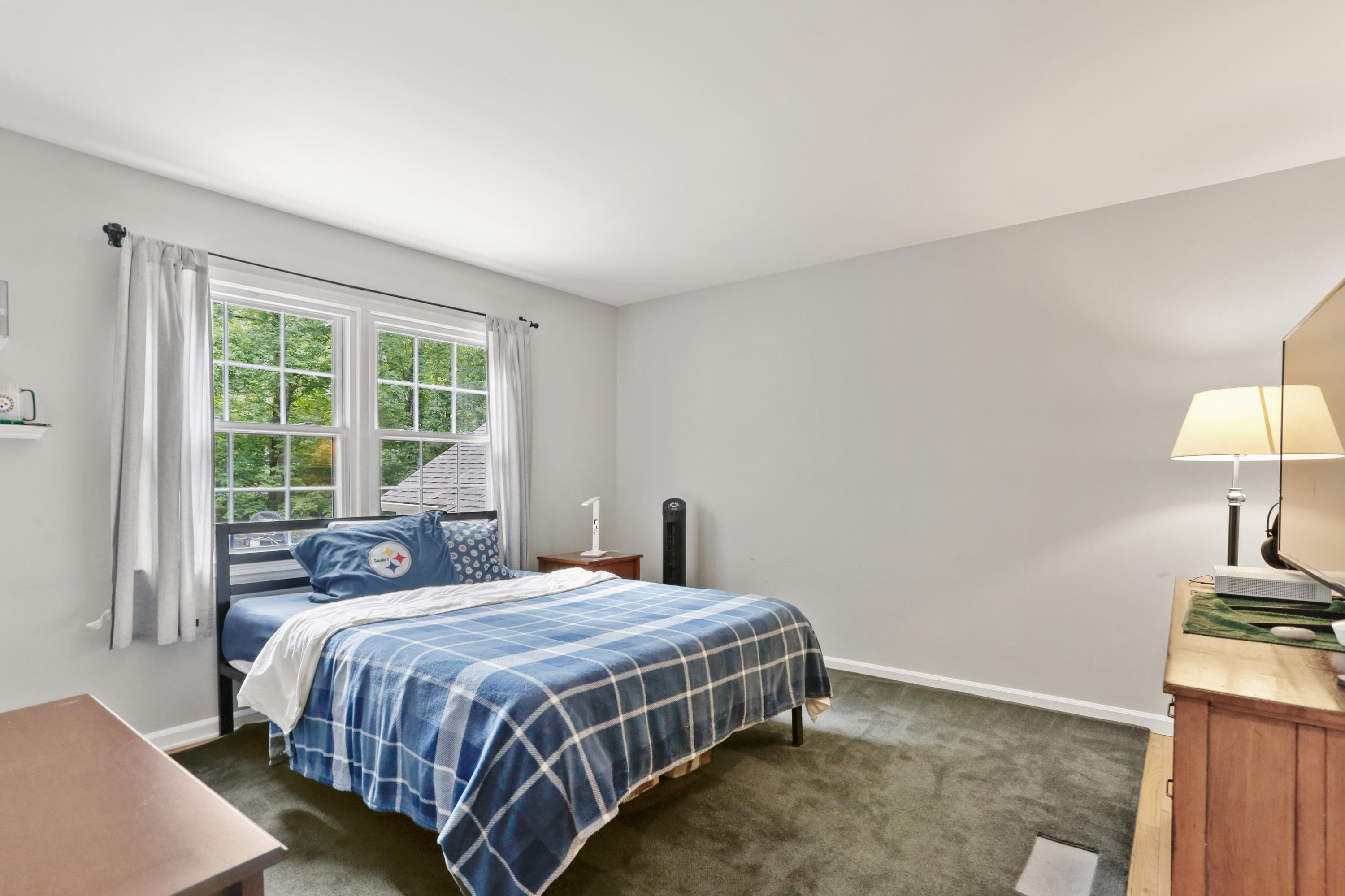 53 Country Club Road Darien, CT 06820 - Photo 22 of 35 a bedroom with a bed lamp and window