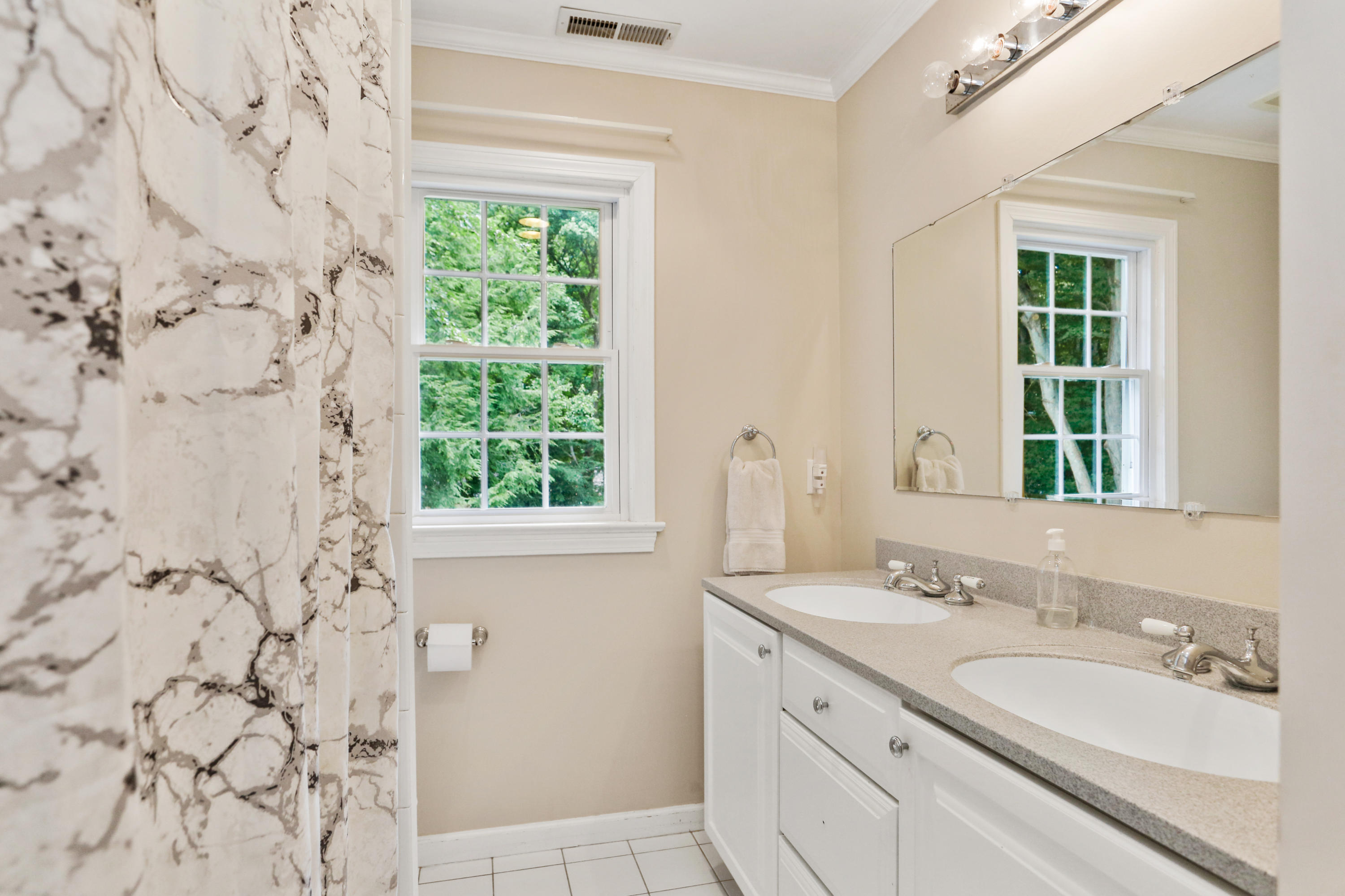 53 Country Club Road Darien, CT 06820 - Photo 23 of 35 a bathroom with a granite countertop sink a mirror and a shower