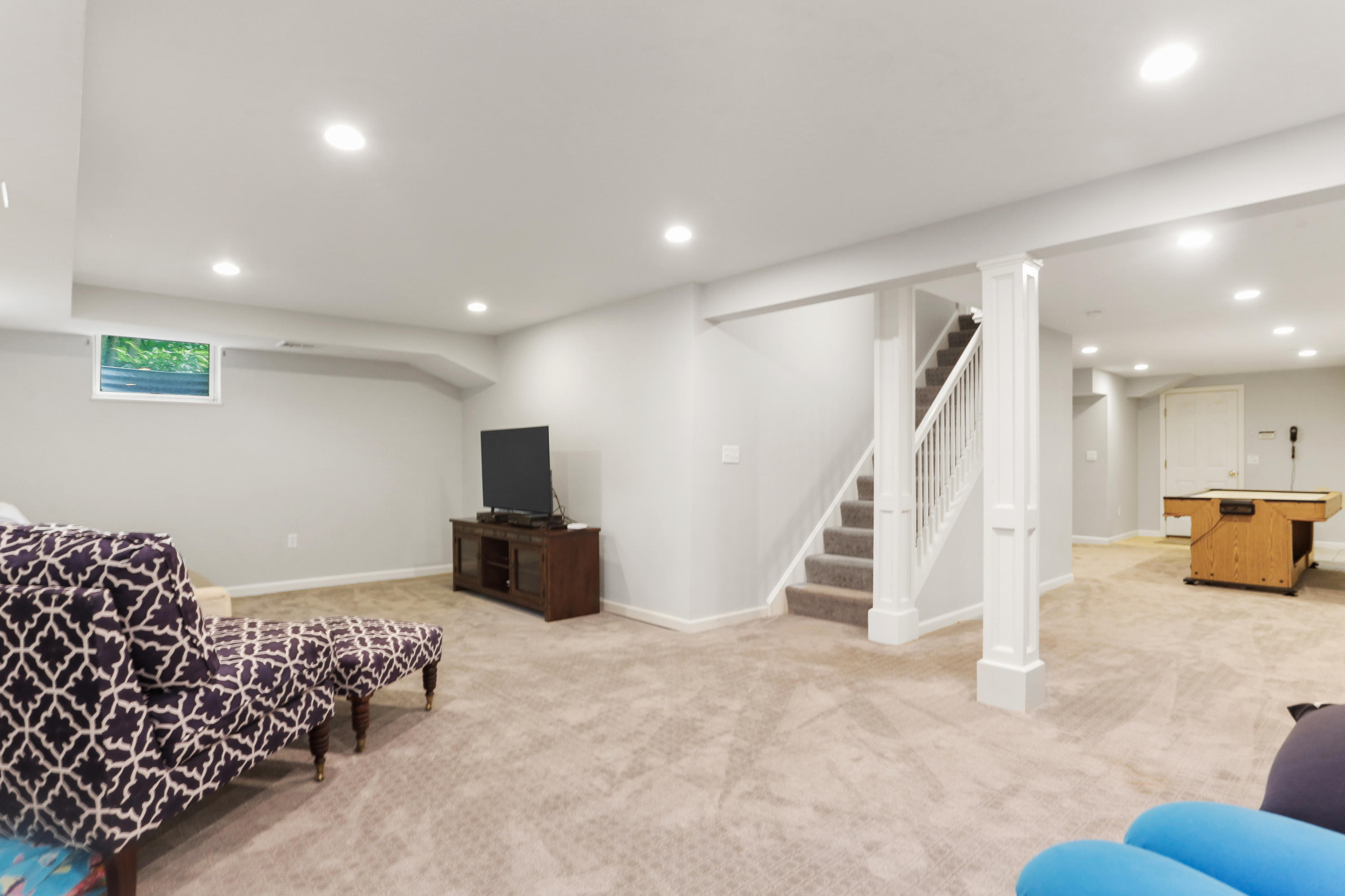 53 Country Club Road Darien, CT 06820 - Photo 27 of 35 a living room with furniture and a flat screen tv