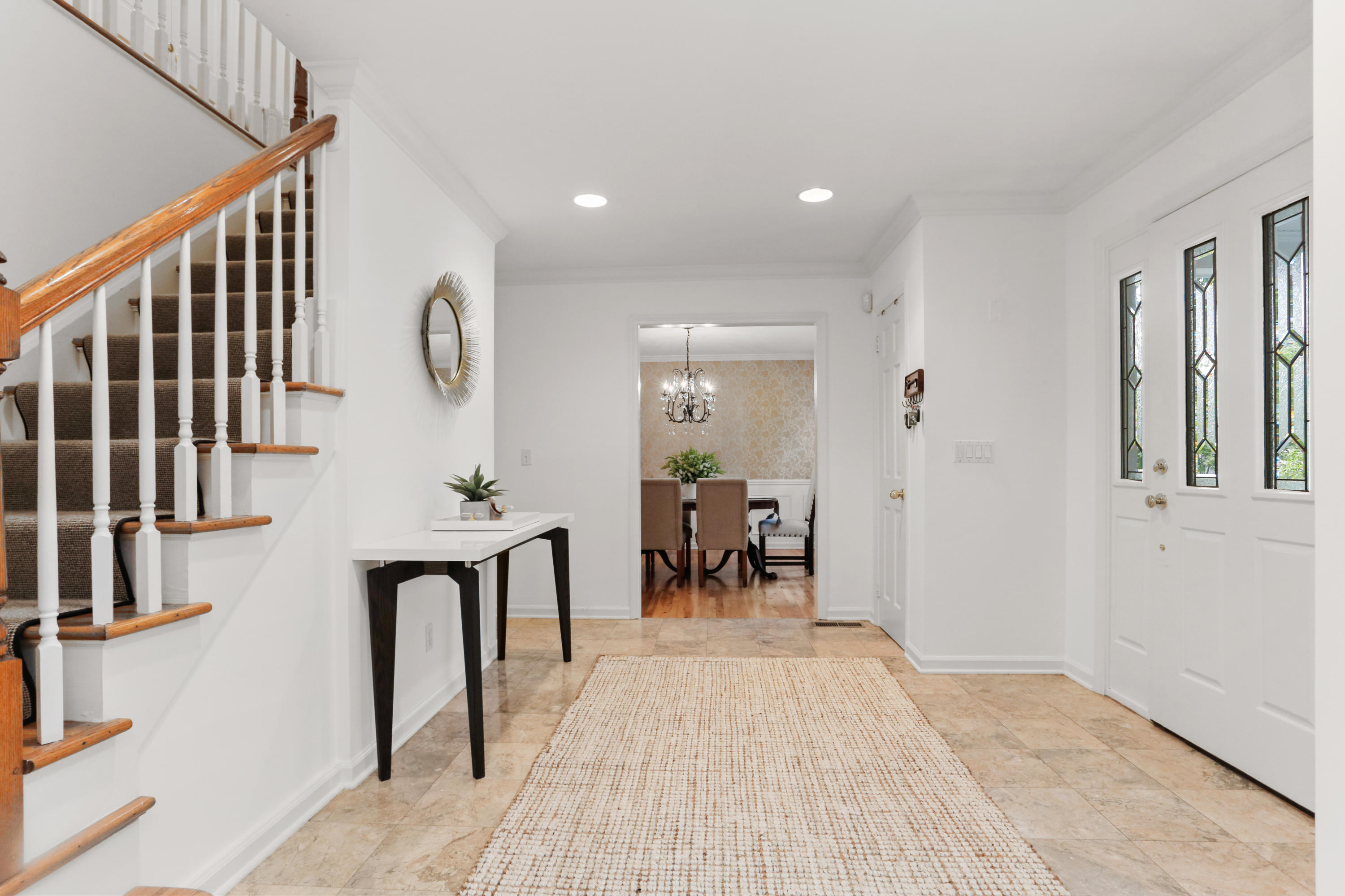 53 Country Club Road Darien, CT 06820 - Photo 4 of 35 a view of a hallway with wooden floor and staircase