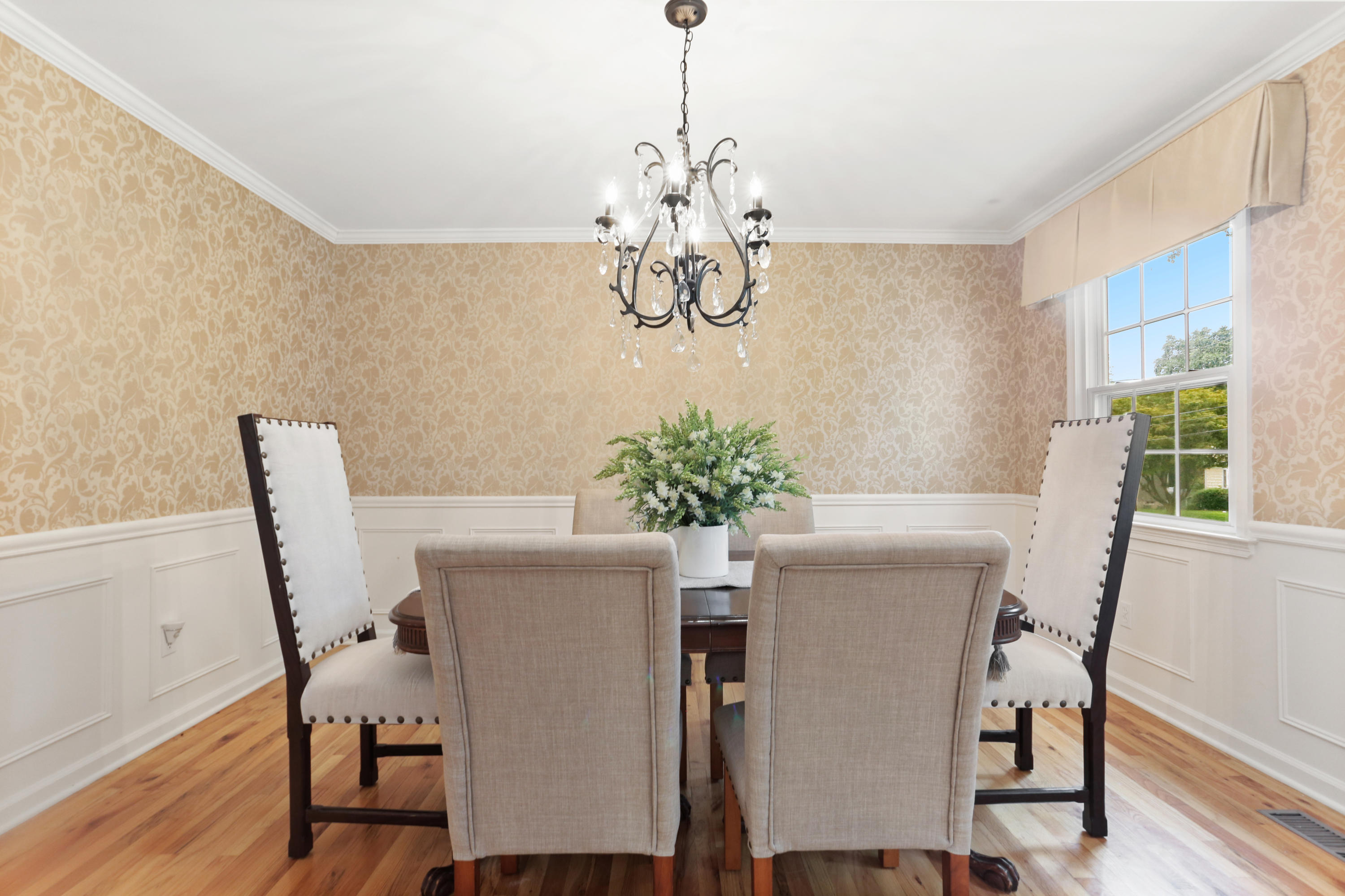 53 Country Club Road Darien, CT 06820 - Photo 5 of 35 a dining room with furniture potted plants and wooden floor