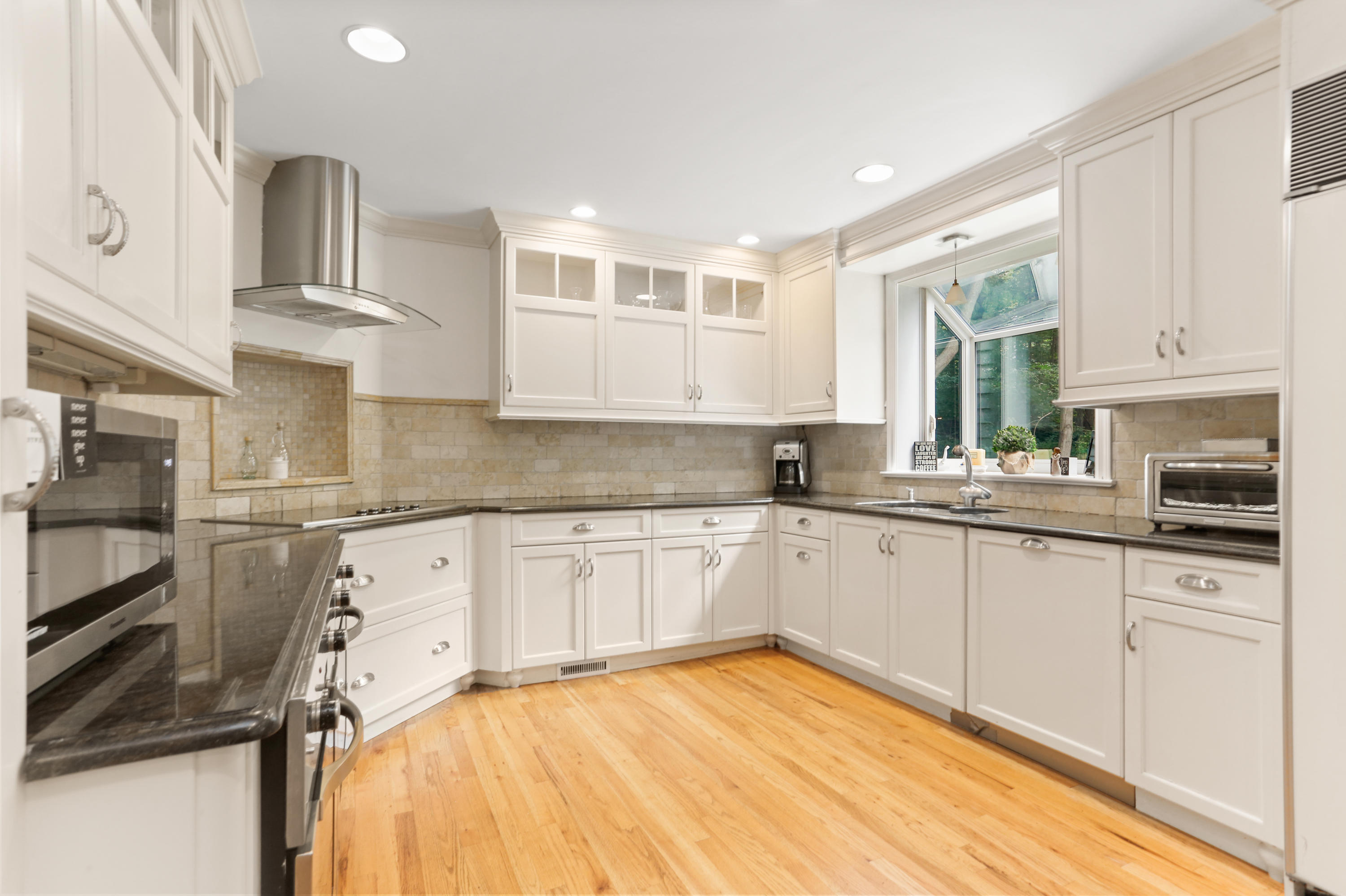 53 Country Club Road Darien, CT 06820 - Photo 9 of 35 a kitchen with stainless steel appliances granite countertop a stove and a sink