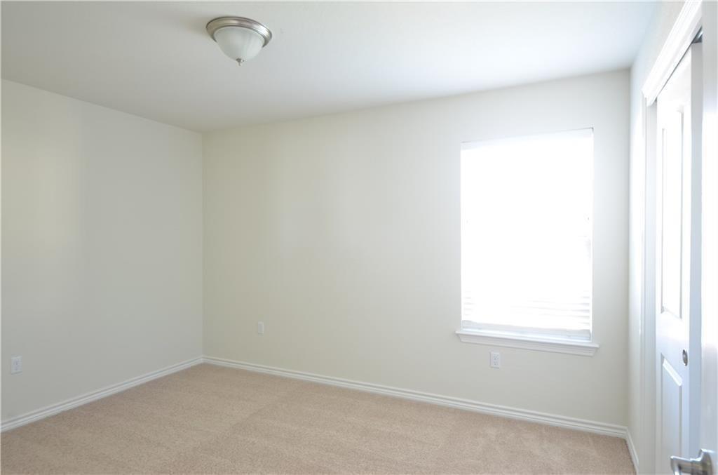 14403 McCoy Loop Austin, TX 78717 - Photo 26 of 29 A well-lit room offers ample space, perfect for personalizing into a cozy retreat.