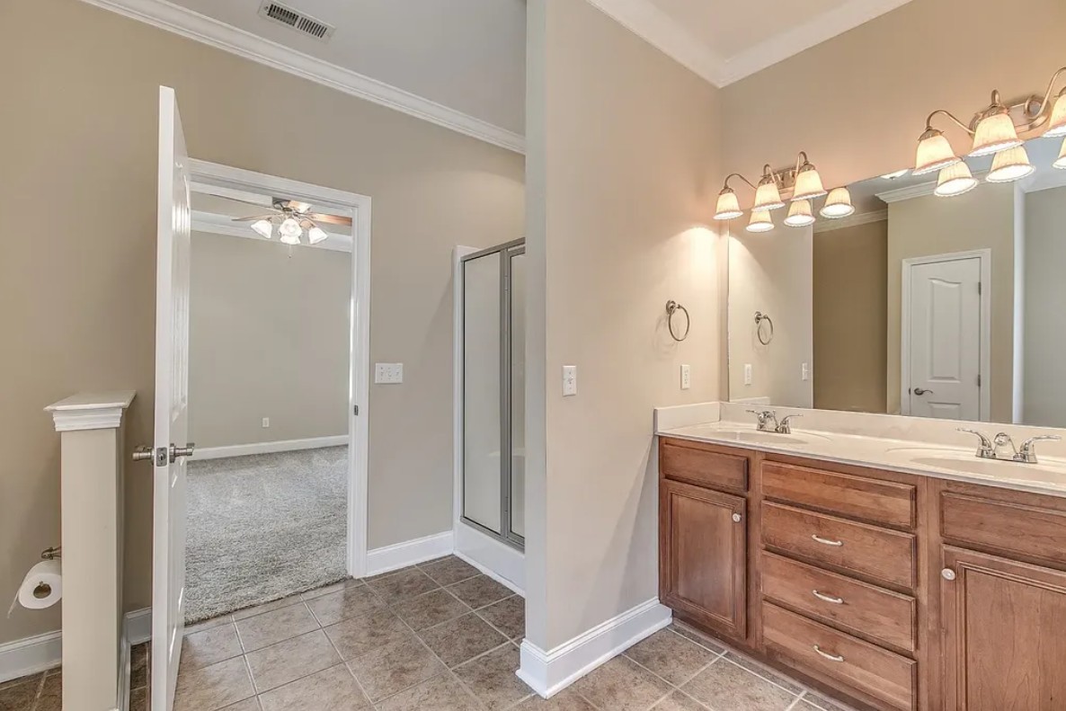 2208 Stanford Court Murfreesboro, TN 37130 - Photo 16 of 18 a bathroom with a double vanity sink and a mirror