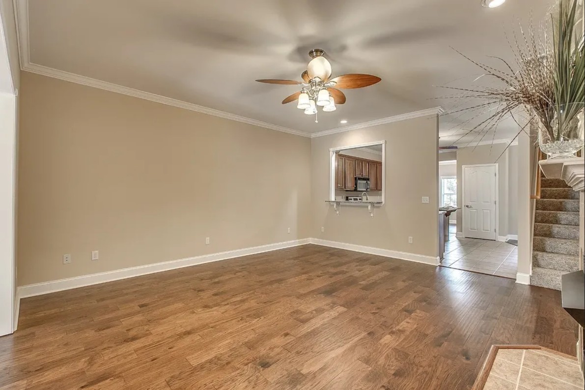 2208 Stanford Court Murfreesboro, TN 37130 - Photo 6 of 18 wooden floor in an empty room with a window