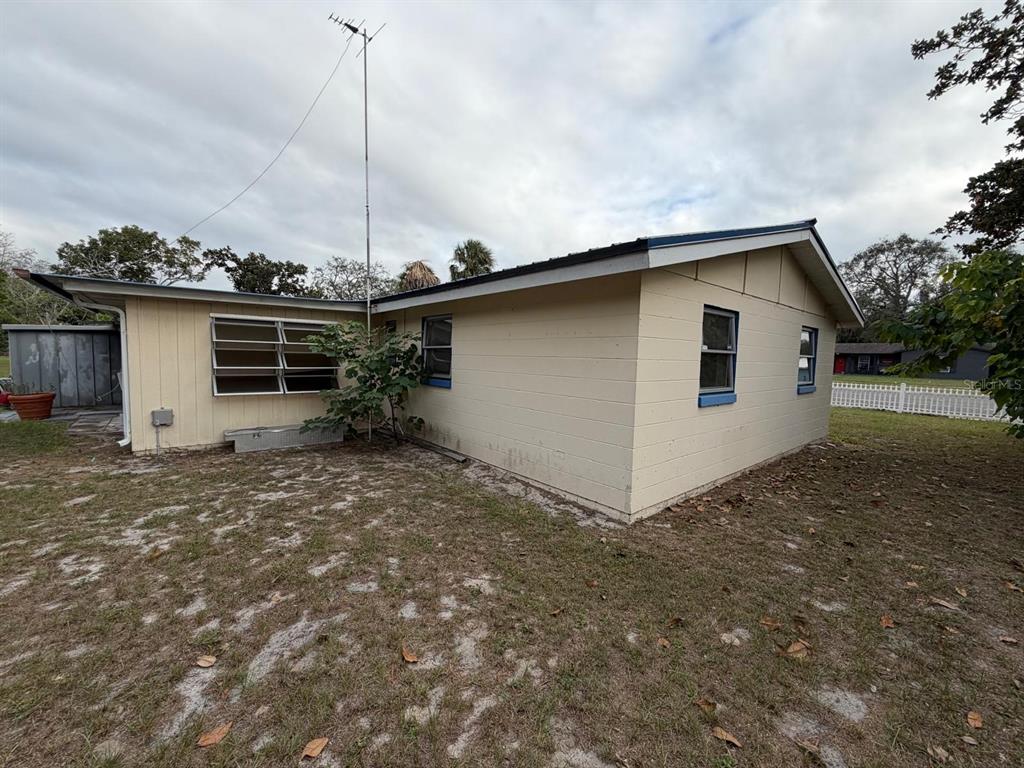 6121 Spring Hill Drive Spring Hill, FL 34606 - Photo 9 of 20 a view of a house with a sink and a yard