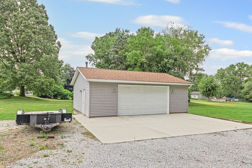 1425 Killian Road Akron, OH 44312 - Photo 32 of 41 Detached garage featuring view of scattered trees