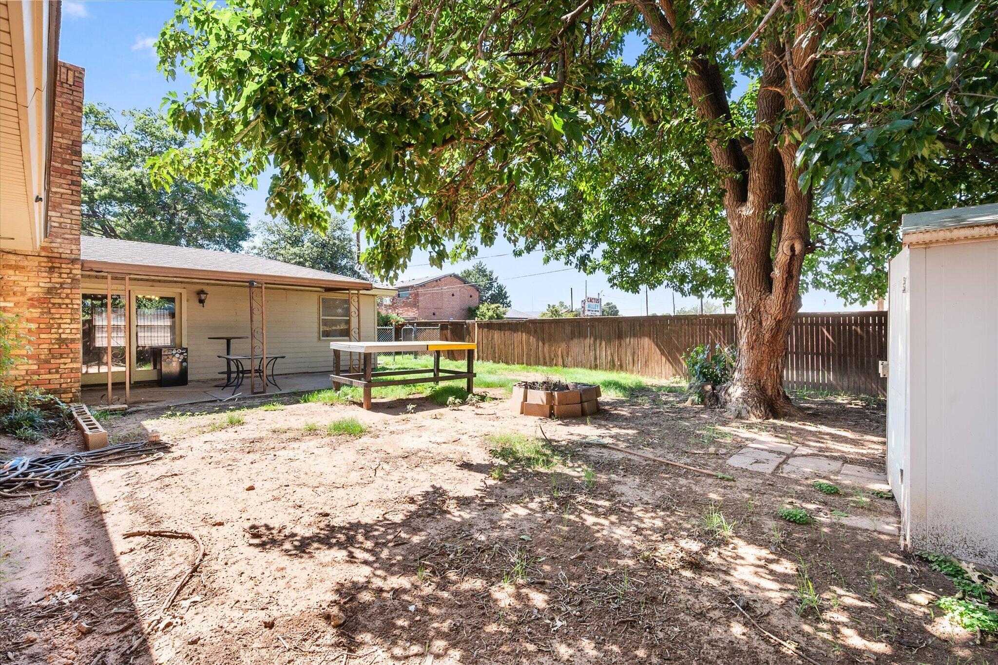 4604 27th Street Lubbock, TX 79410 - Photo 35 of 36 a view of a house with backyard and sitting area