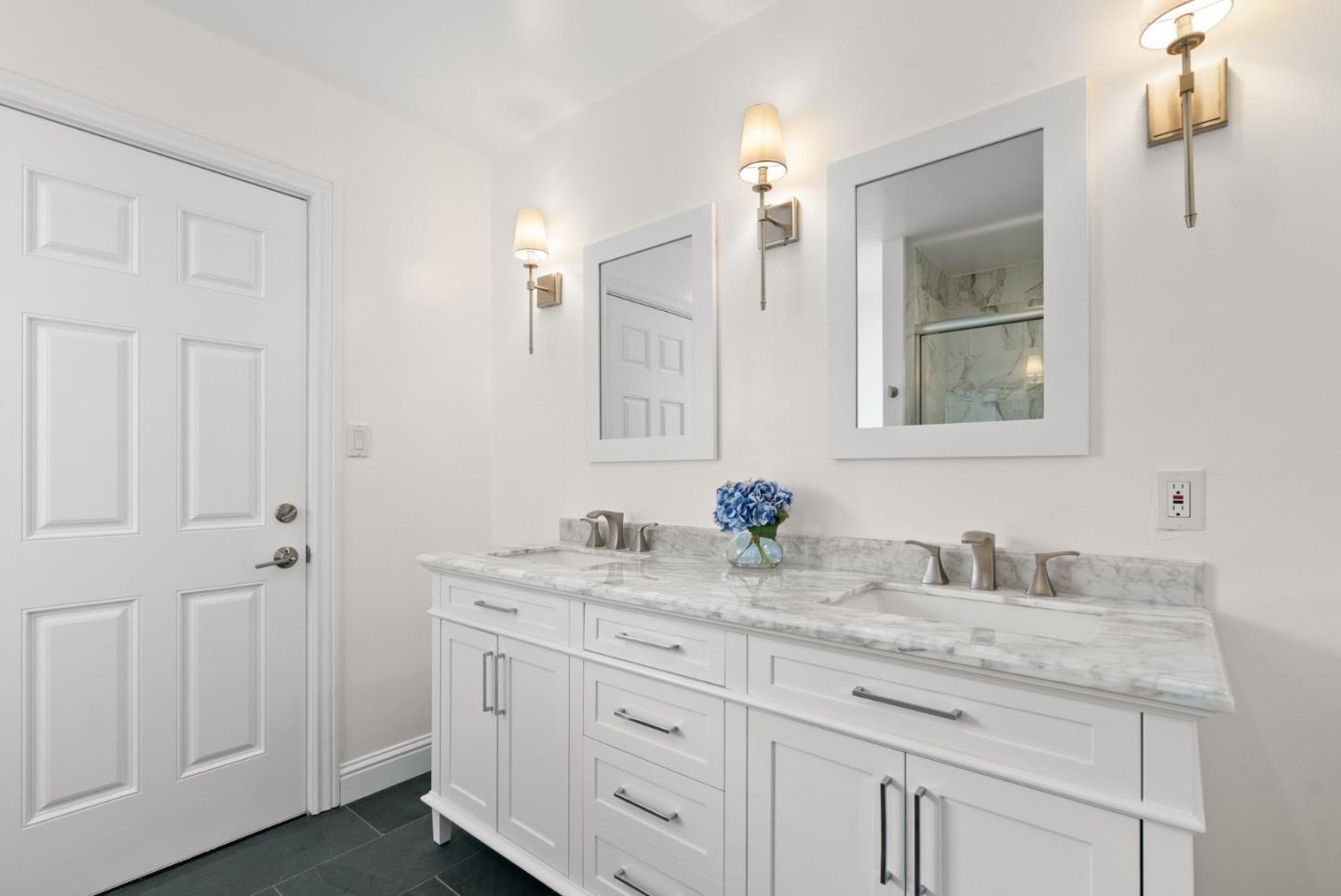 770 Graham Hill Road Santa Cruz, CA 95060 - Photo 53 of 83 a bathroom with a granite countertop sink double and mirror