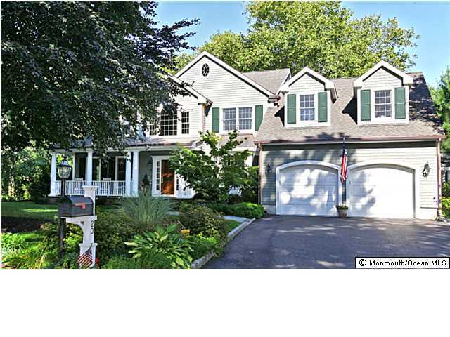 20 Robin Road Rumson, NJ 07760 - Photo 1 of 16 a front view of a house with a garden