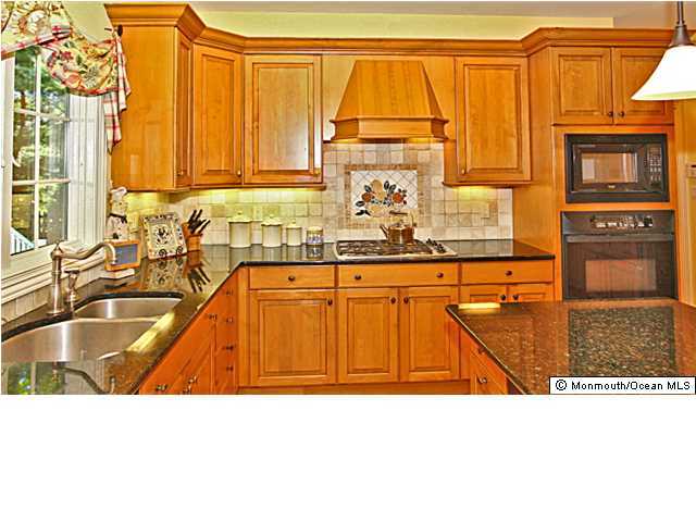 20 Robin Road Rumson, NJ 07760 - Photo 12 of 16 a bathroom with a sink a bathtub and window