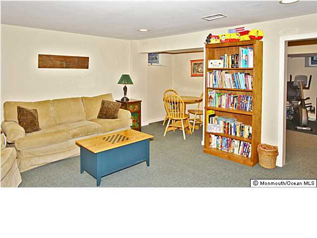 20 Robin Road Rumson, NJ 07760 - Photo 8 of 16 a living room with furniture and a book shelf