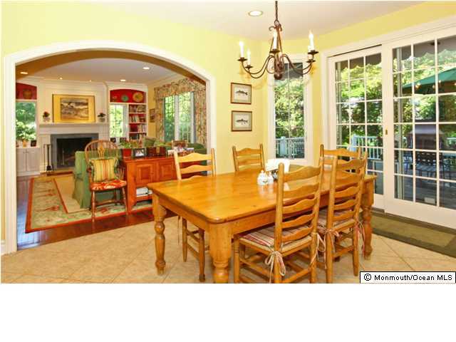20 Robin Road Rumson, NJ 07760 - Photo 9 of 16 a dining room with furniture a chandelier and wooden floor