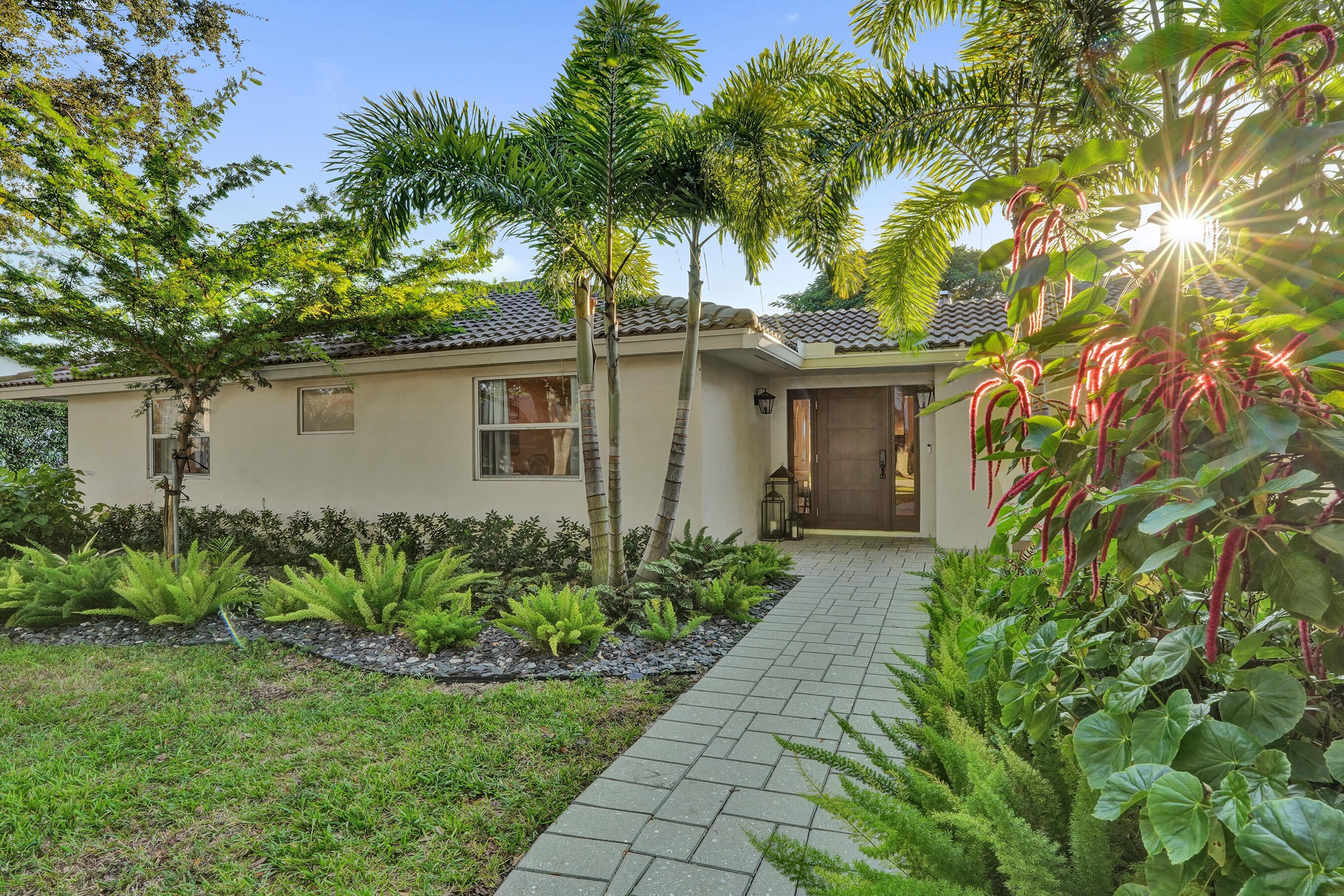 3681 Northwest 24th Terrace Boca Raton, FL 33431 - Photo 2 of 78 a front view of house with yard and green space