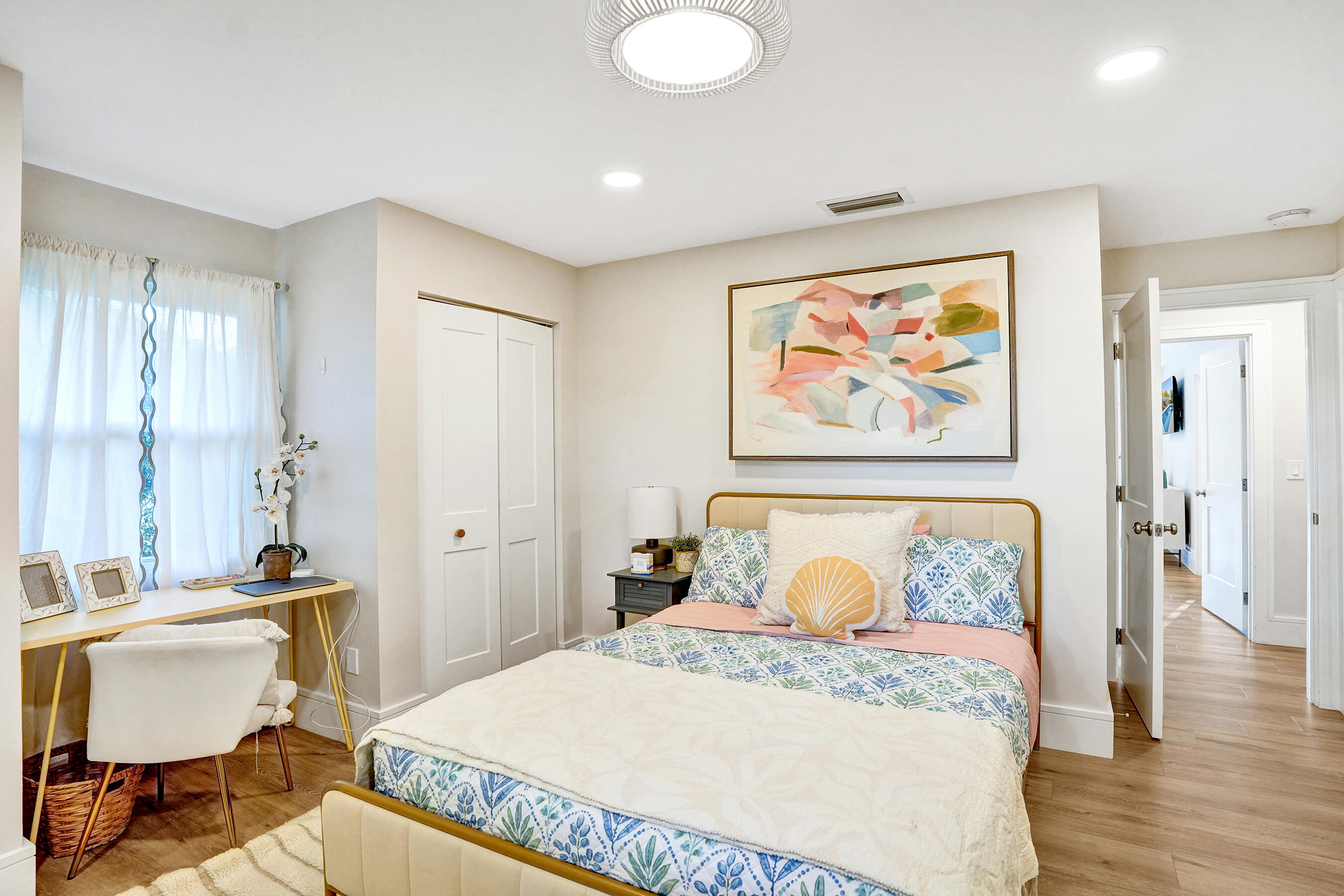 3681 Northwest 24th Terrace Boca Raton, FL 33431 - Photo 46 of 78 a bedroom with a bed and wooden floor