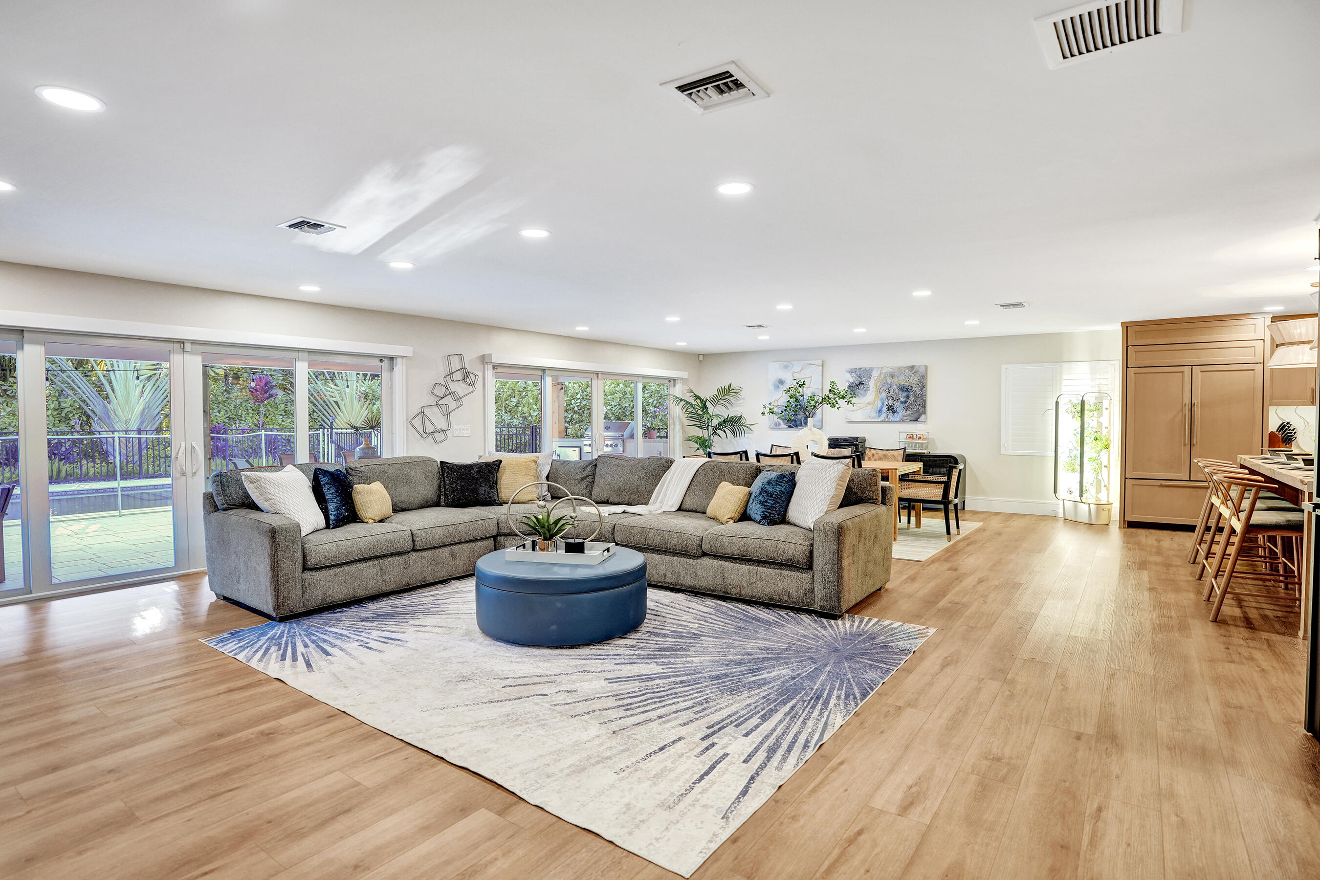 3681 Northwest 24th Terrace Boca Raton, FL 33431 - Photo 8 of 78 a living room with furniture and a wooden floor