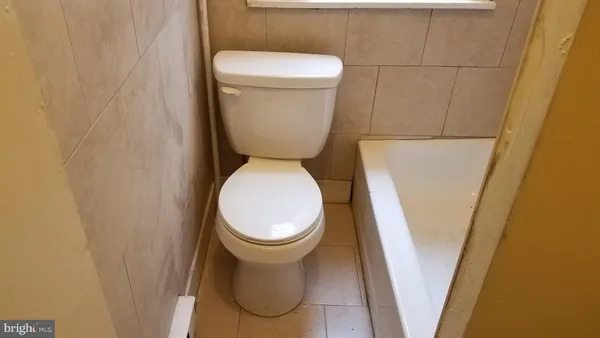 a bathroom with a toilet and a sink