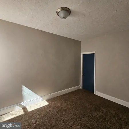 an empty room with a empty space and window