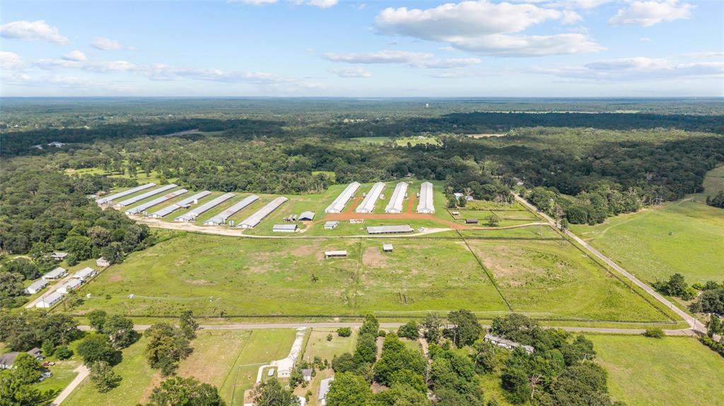 3216 Old Ewing Road Lufkin, TX 75901 - Photo 4 of 24 Expansive agricultural property featuring multiple pou, extensive open land, and perimeter fencing