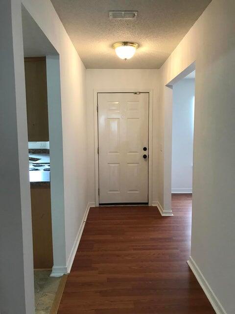 294 Limestone Circle Crestview, FL 32539 - Photo 2 of 9 wooden floor in a hall with an entryway