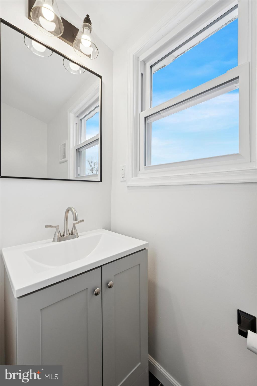 425 Grove Street Bridgeport, PA 19405 - Photo 12 of 24 a bathroom with a sink and a mirror