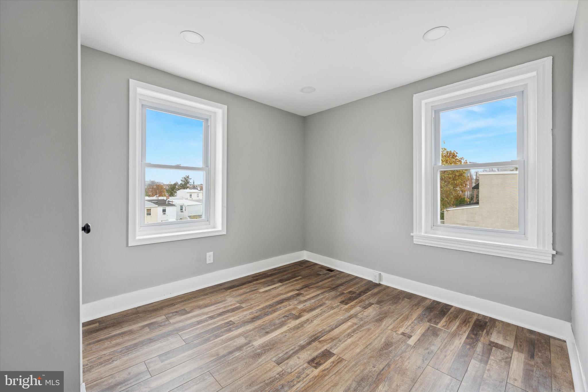 425 Grove Street Bridgeport, PA 19405 - Photo 13 of 24 a view of empty room with window and wooden floor
