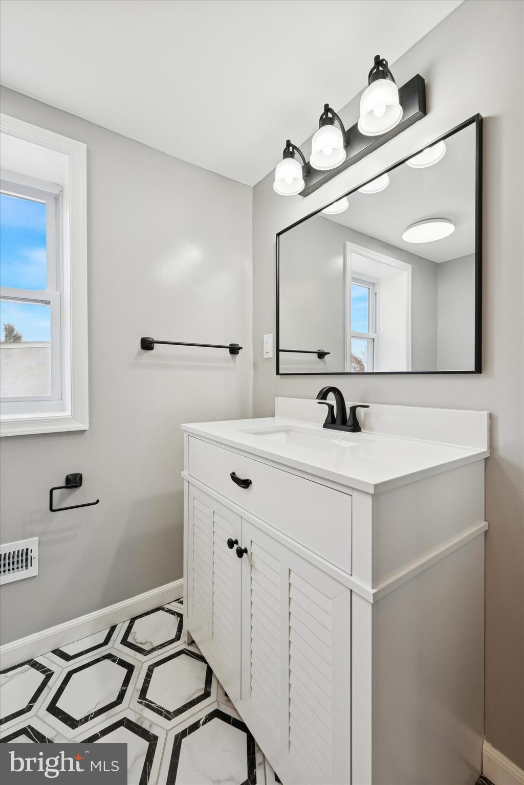 425 Grove Street Bridgeport, PA 19405 - Photo 16 of 24 a bathroom with a sink and a mirror