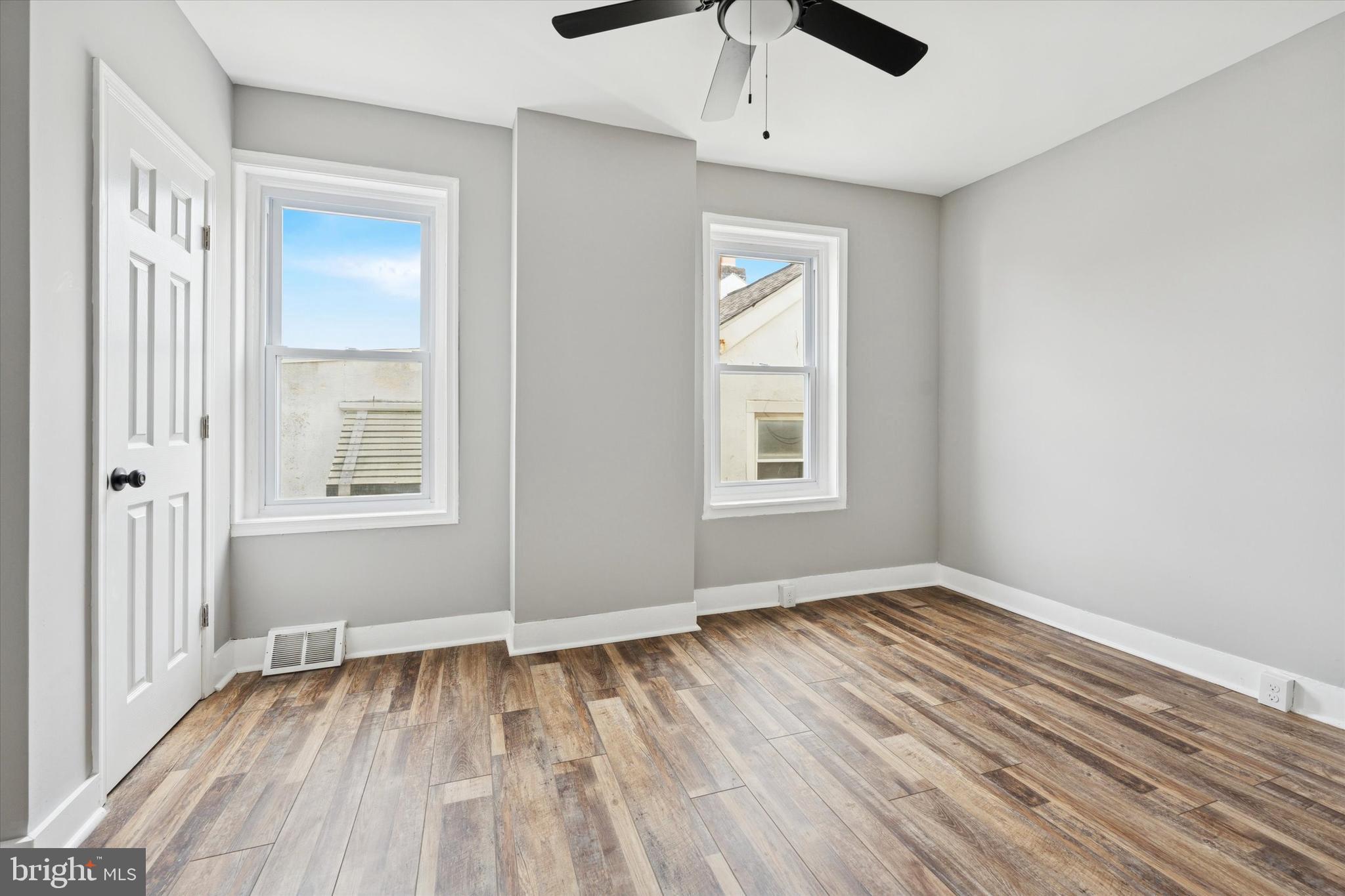 425 Grove Street Bridgeport, PA 19405 - Photo 18 of 24 a view of an empty room with wooden floor and a window