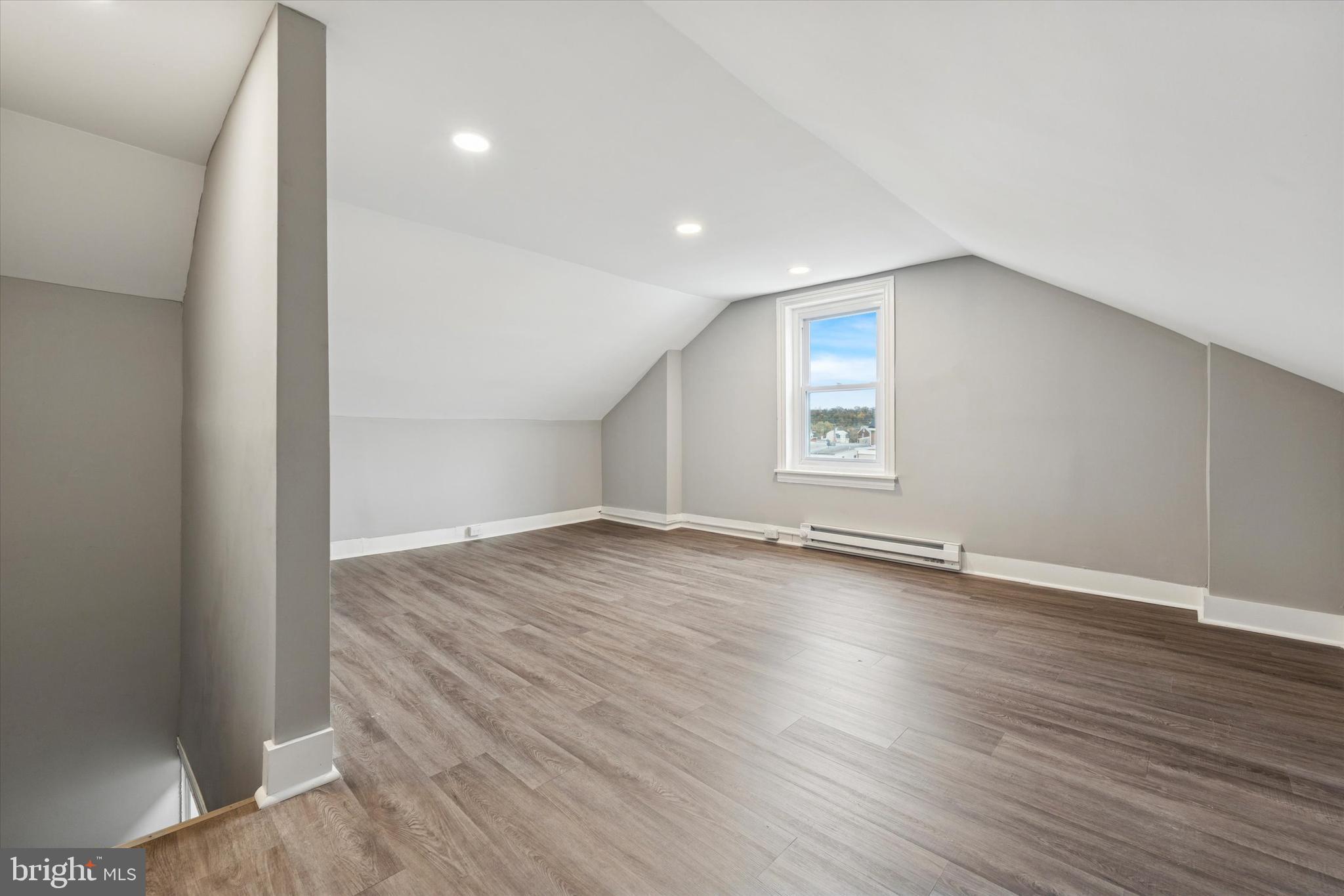 425 Grove Street Bridgeport, PA 19405 - Photo 22 of 24 an empty room with wooden floor and windows