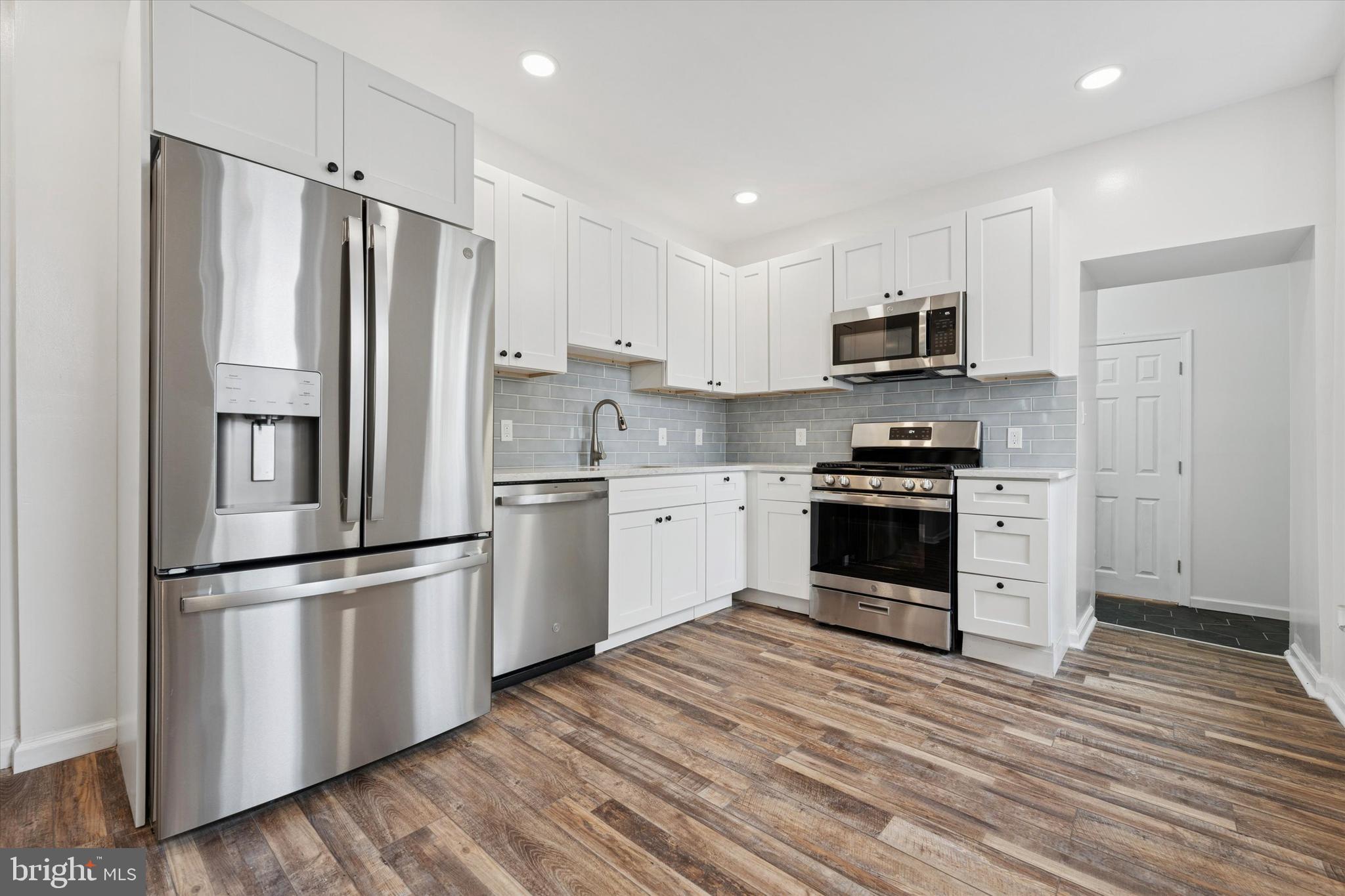 425 Grove Street Bridgeport, PA 19405 - Photo 7 of 24 a kitchen with stainless steel appliances a refrigerator sink and microwave