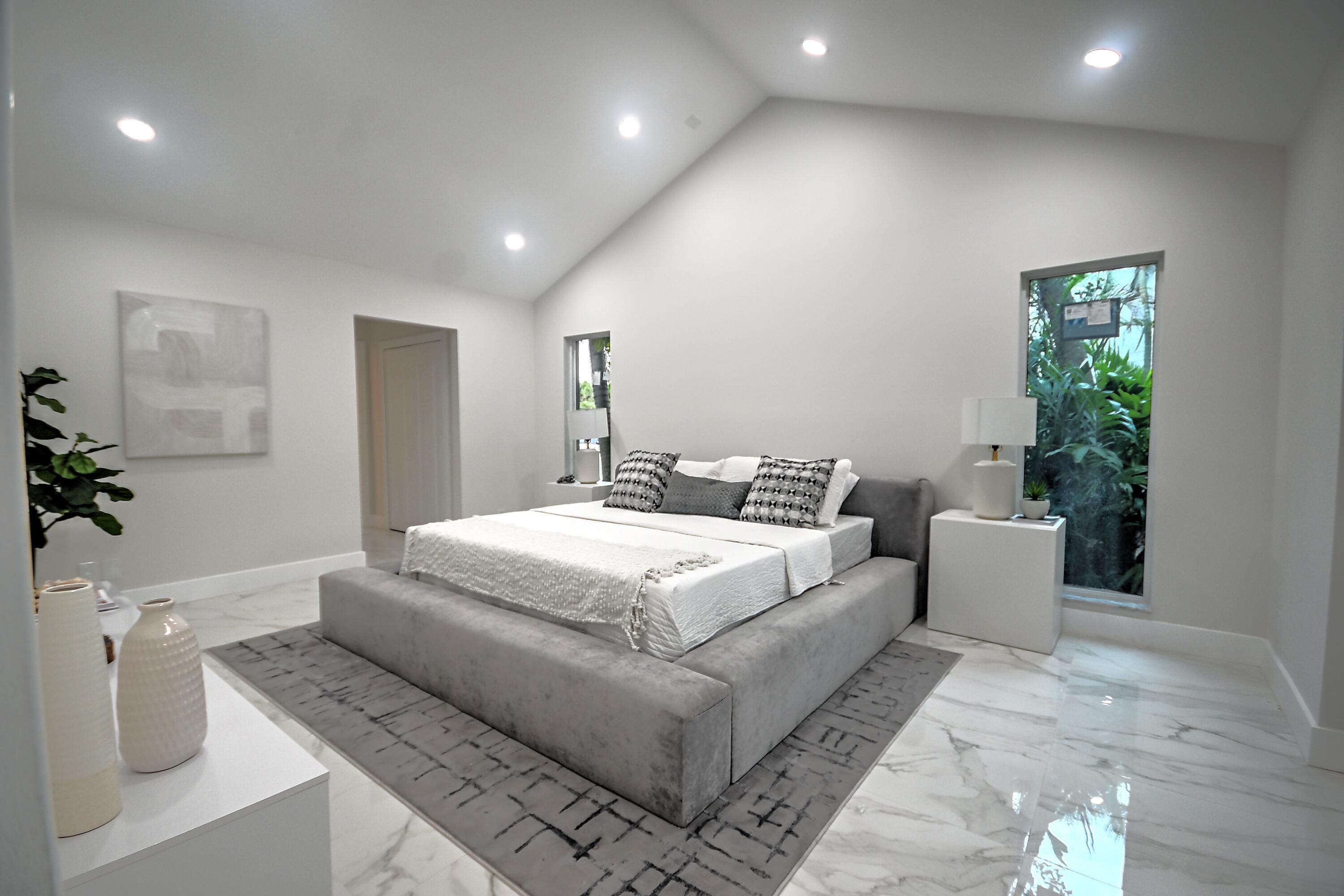 10077 Camelback Lane Boca Raton, FL 33498 - Photo 17 of 52 a bedroom with a large bed and a couch