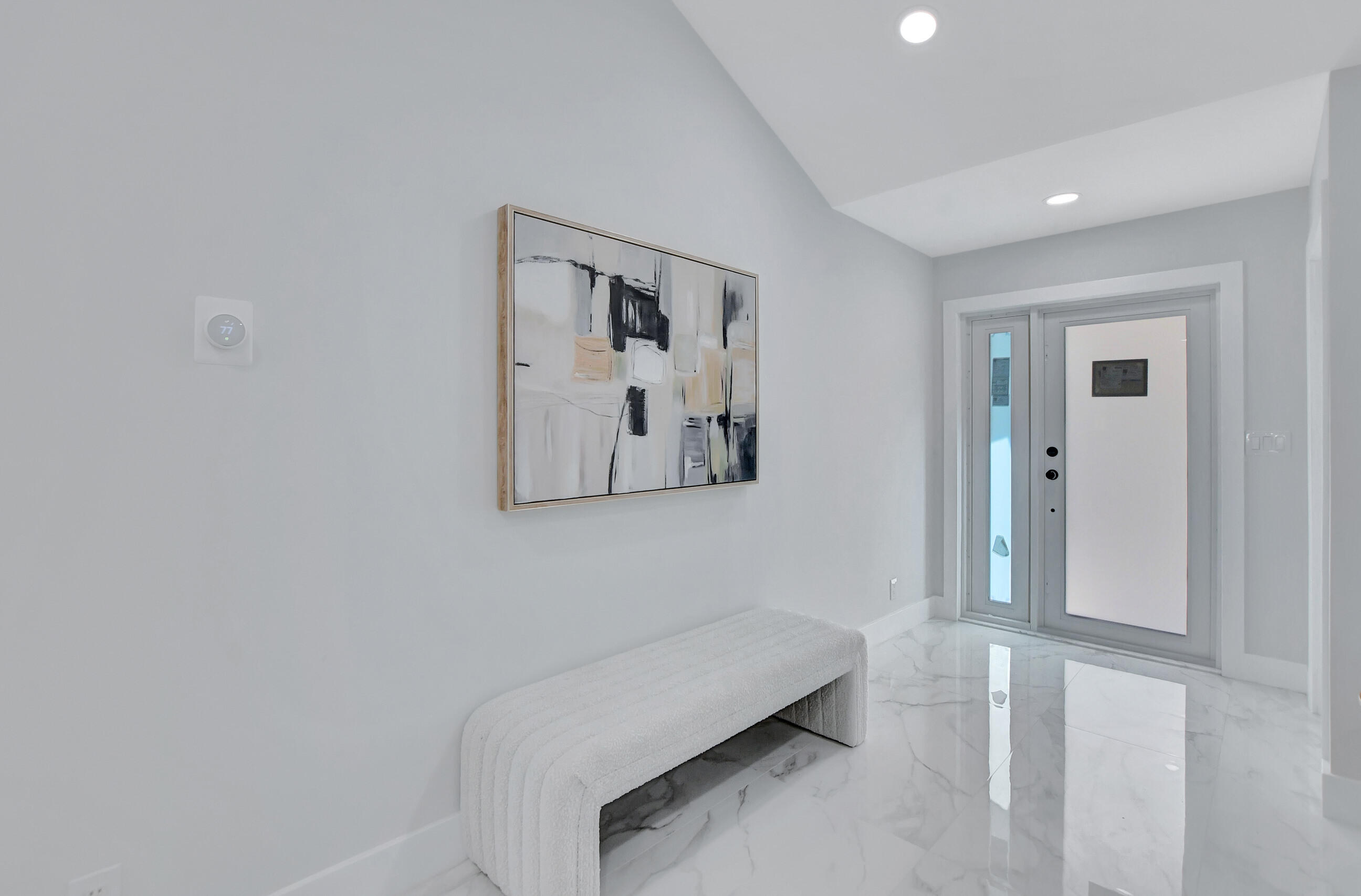 10077 Camelback Lane Boca Raton, FL 33498 - Photo 4 of 52 a hallway with a large mirror on a dresser