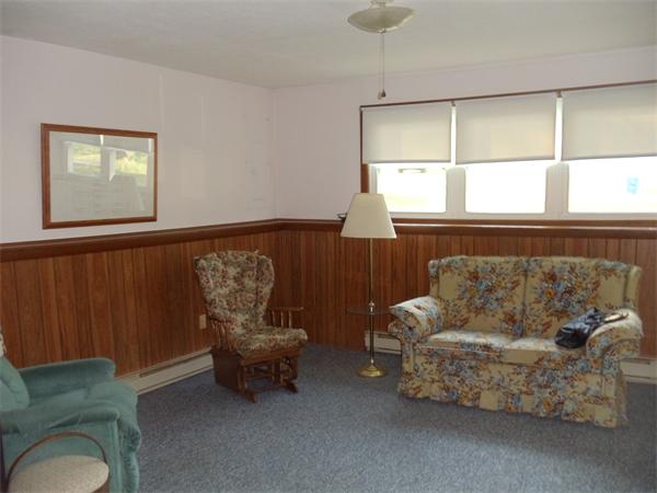 17 Meadow Road Ware, MA 01082 - Photo 11 of 15 a living room with furniture and a window