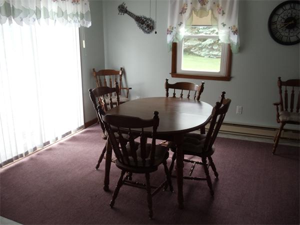 17 Meadow Road Ware, MA 01082 - Photo 3 of 15 a view of a dining room with furniture and chandelier