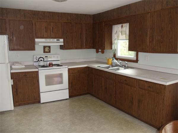17 Meadow Road Ware, MA 01082 - Photo 4 of 15 a kitchen with a sink stove and cabinets