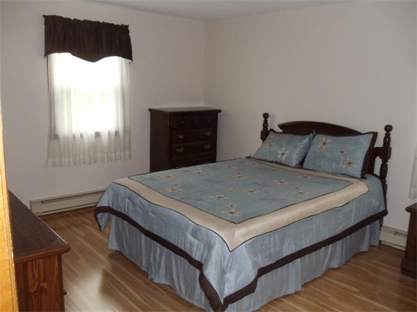 17 Meadow Road Ware, MA 01082 - Photo 5 of 15 a bedroom with a bed and window